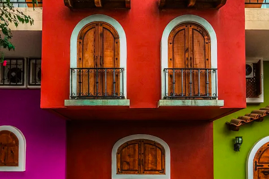 This is an image of a facade of a house painted in various colors