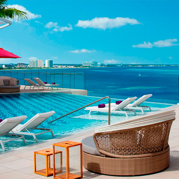This is an image of the outdoor pool with ocean views at Breathless® Cancun Soul Resort & Spa